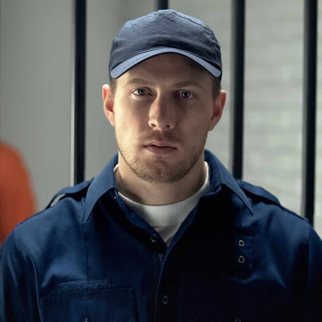Man in navy work uniform and cap