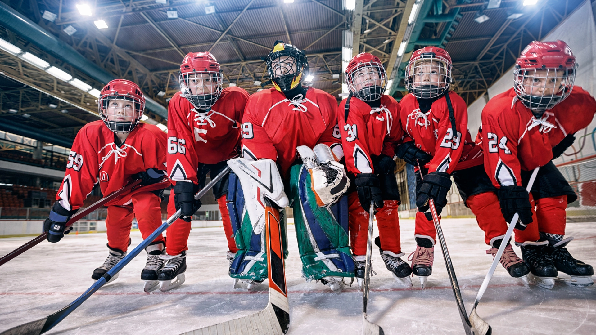 Youth hockey team lined up on ice rink