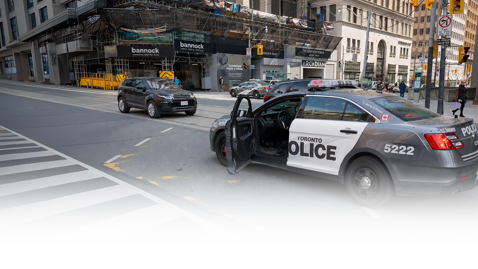 Toronto police car parked at downtown intersection